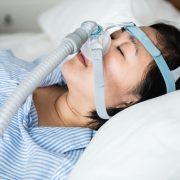 woman-wearing-anti-snoring-chin-straps