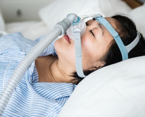 woman-wearing-anti-snoring-chin-straps